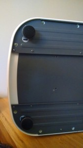 Underside of the printer showing the screw points