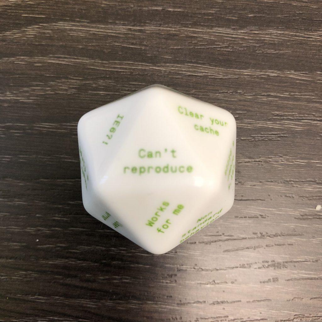 twenty sided die showing common excuses for developers not to fix problems, the top of the die shows "Can't reproduce"